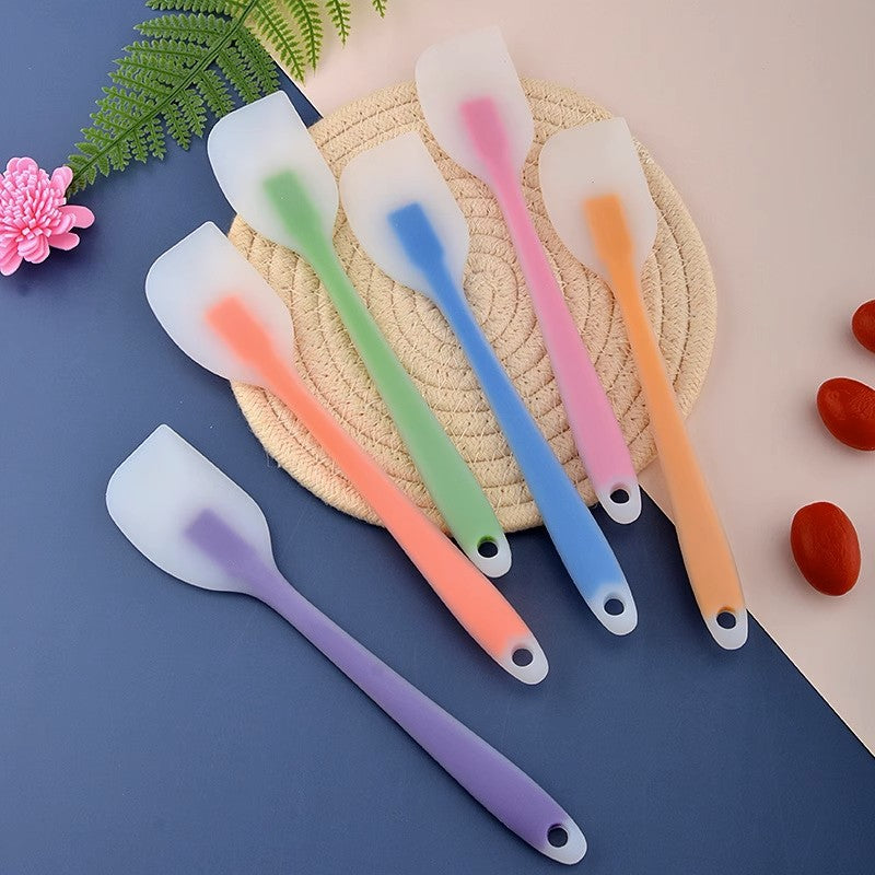 One-piece cream silicone scraper